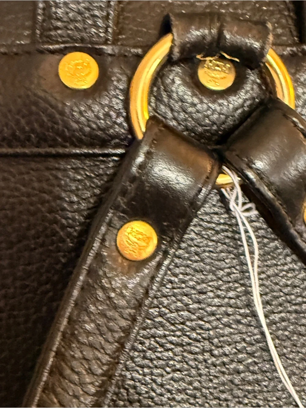 MCM Black Leather Backpack with Gold Accents and Front Pockets